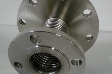 Stainless steel expansion joint with custom outlet flange